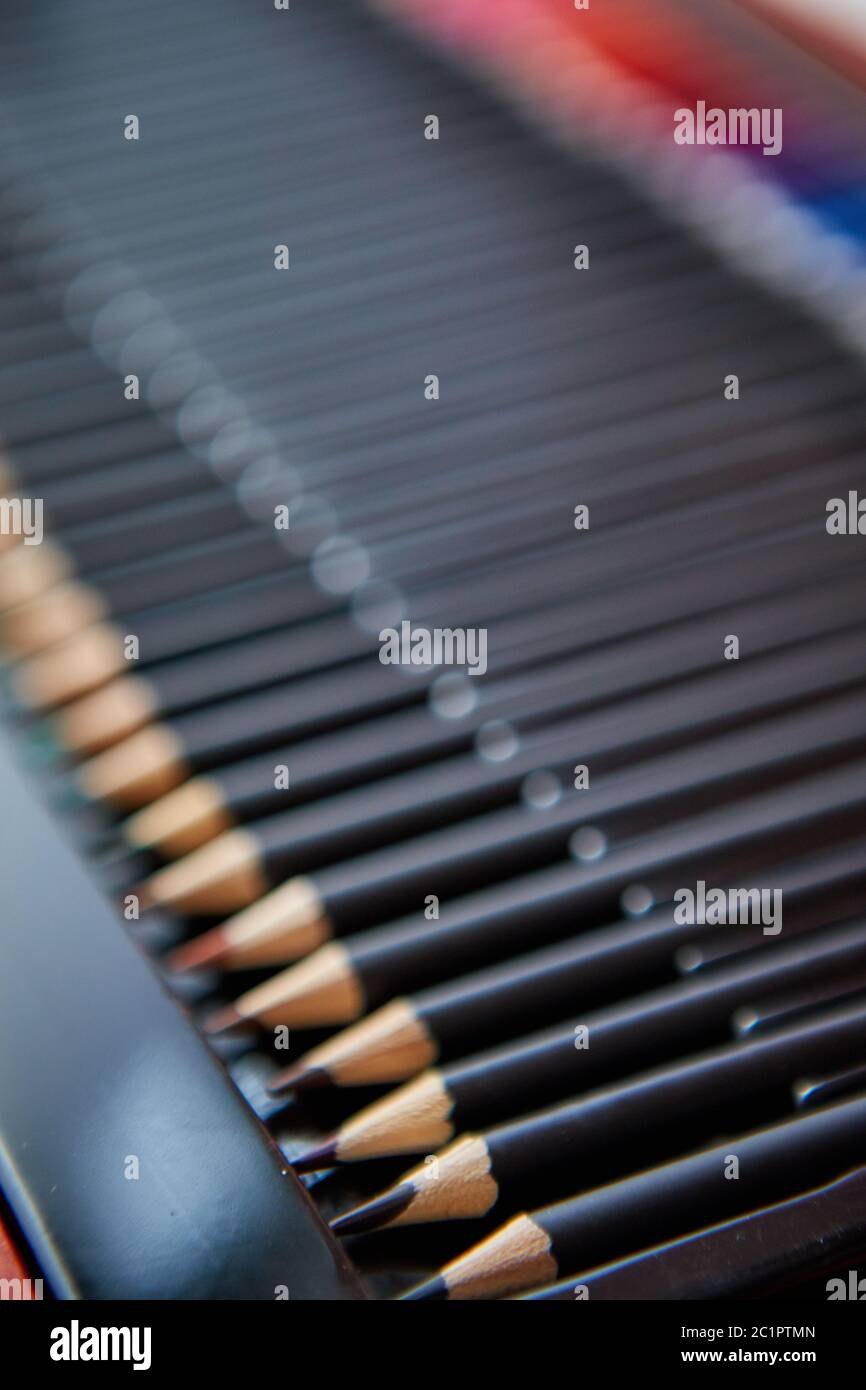 Selective focus shot of a row of professional colored pencils Stock Photo