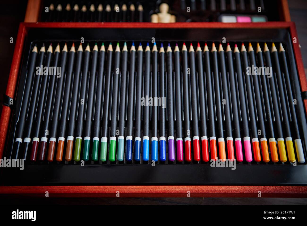 Selective focus shot of a row of professional colored pencils Stock Photo