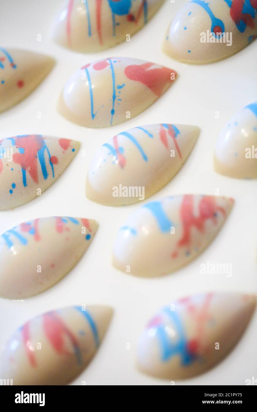 Different chocolate sweets on the white background. Stock Photo