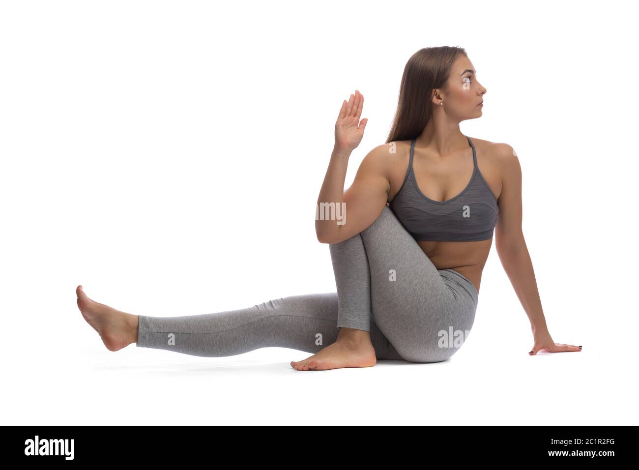 Girl practicing yoga in a studio on a white background. Isolate Stock ...
