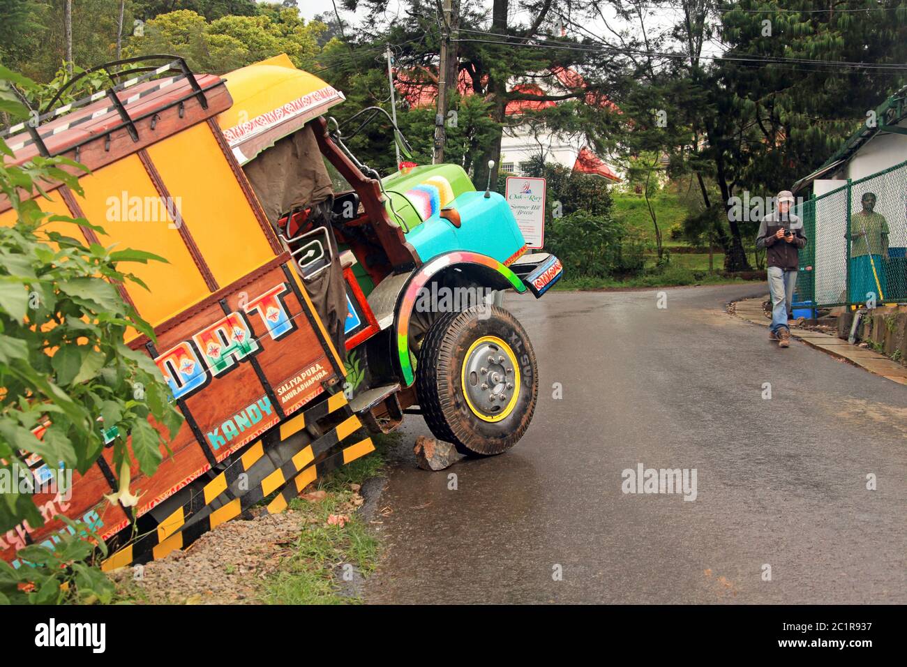 Kandy, Sri Lanka - December 07, 2012: traffic accident in which a heavy truck drove into a ravine from a steep and slippery road Stock Photo