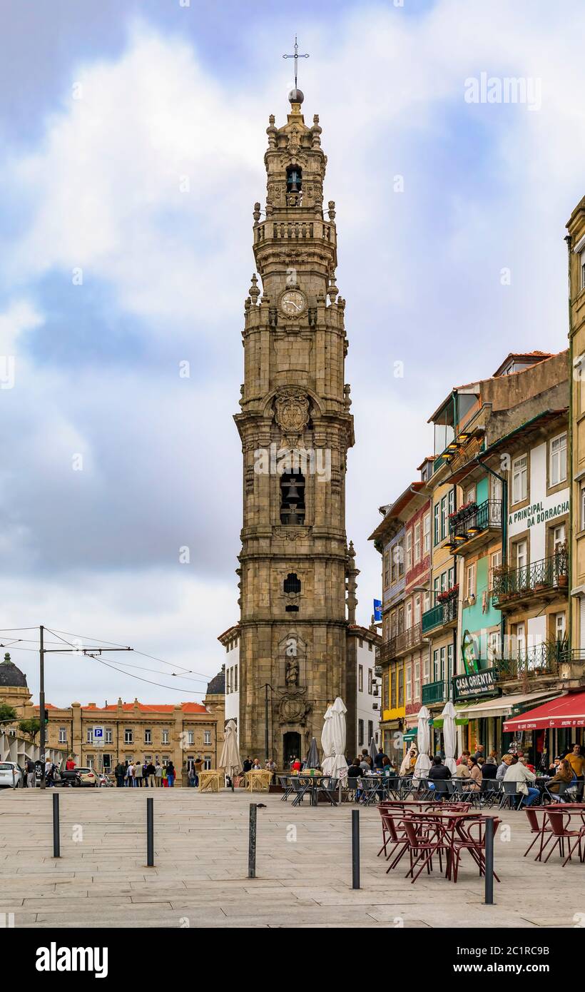 Porto, Portugal - May 31, 2018: Cityscape with Torre dos Clerigos church bell tower and outdoor cafes in traditional houses with ornate azulejo tiles Stock Photo