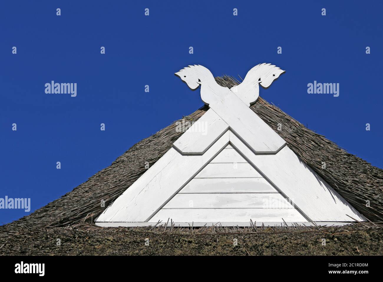 White Horse Heads on low-German Hall House Stock Photo
