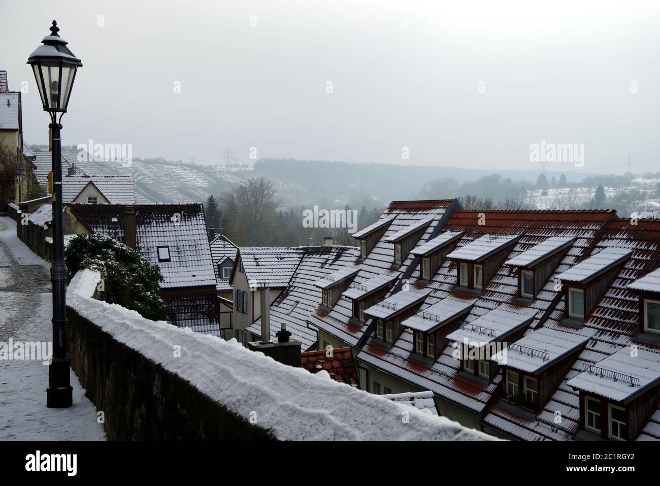 house roof with many roof dormers after snowfall Stock Photo