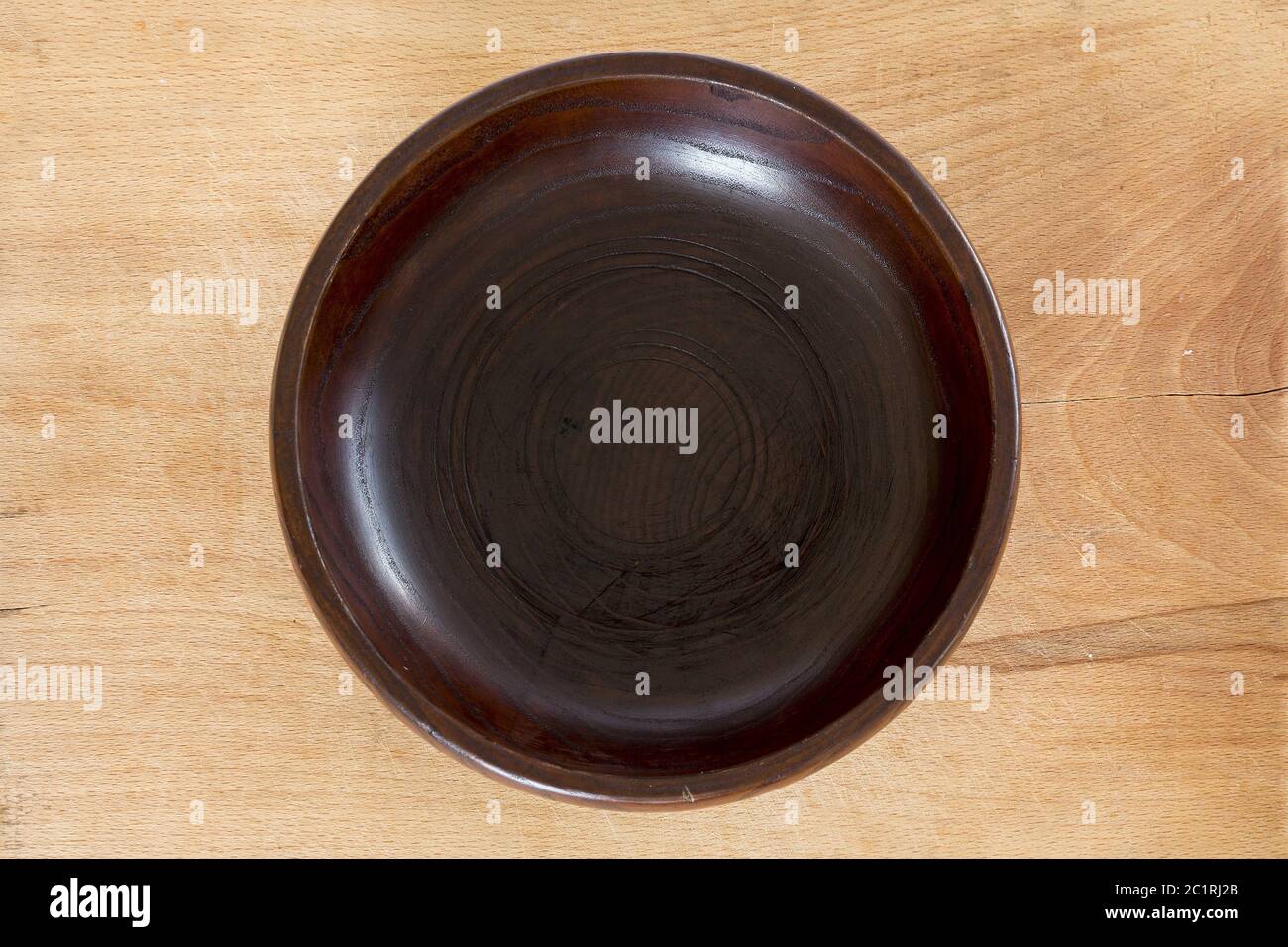 Wooden plate on wooden background Stock Photo