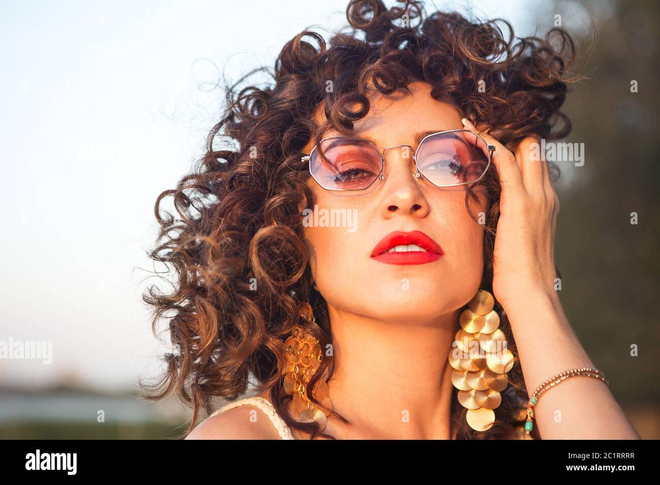 Party girl at summer festival wearing pink sunglasses Stock Photo Alamy