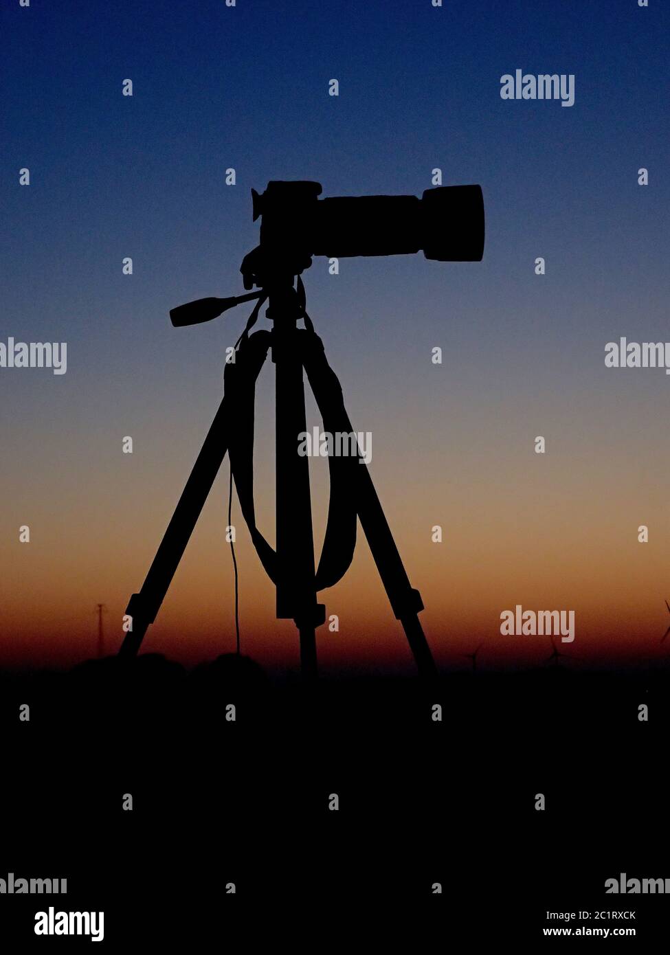 Camera in front of the evening sky Stock Photo