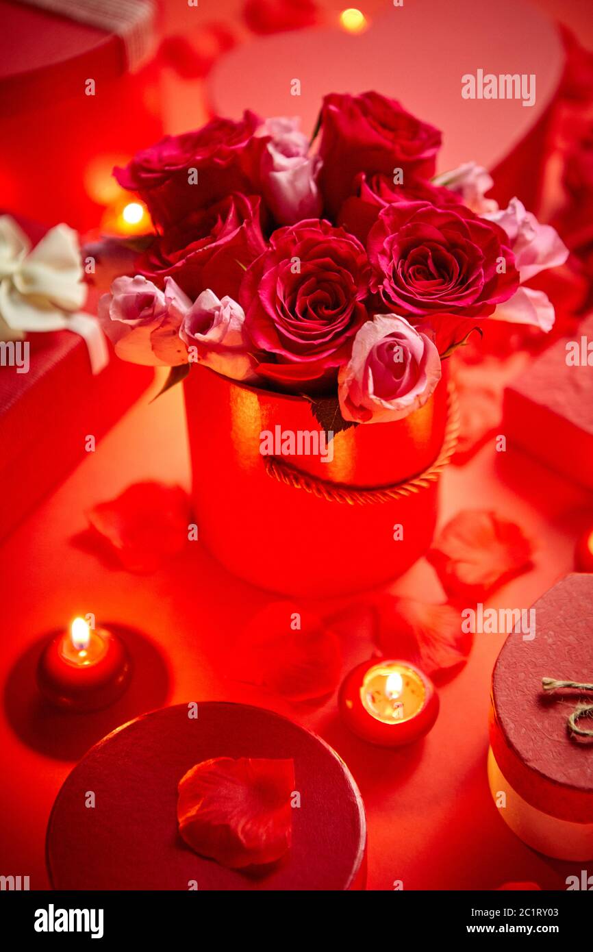 Valentines day romantic decoration with roses, boxed gifts, candles Stock Photo