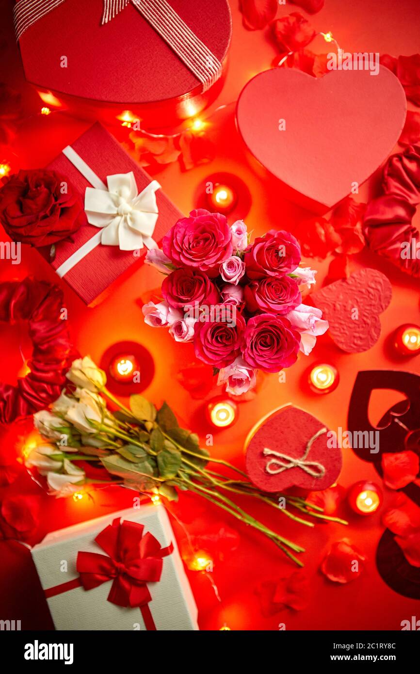 Valentines day romantic decoration with roses, boxed gifts, candles Stock Photo