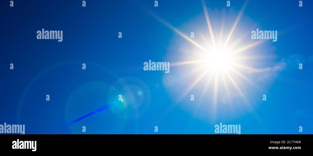 Hot summer or heat wave background, wonderful blue sky with glowing sun Stock Photo