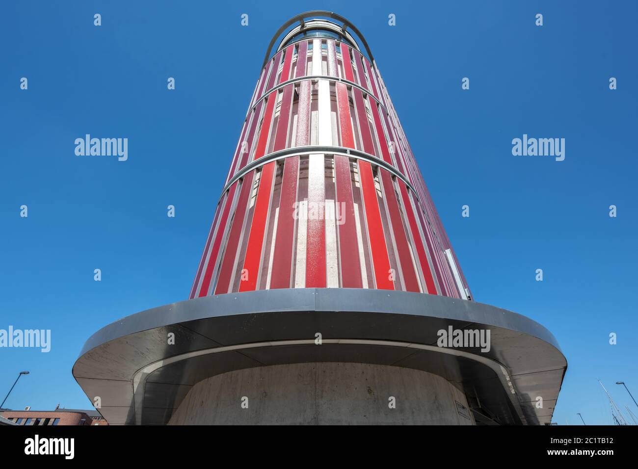 Wismar, Germany, June 16, 2020: Public multi storey car parking garage in the old harbor of Wismar, Germany, modern architecture against a blue sky Stock Photo