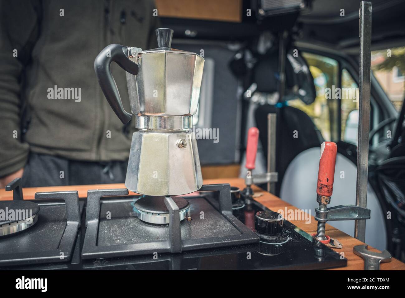 Coffee maker on a newly installed gas stove in a camper van Stock Photo