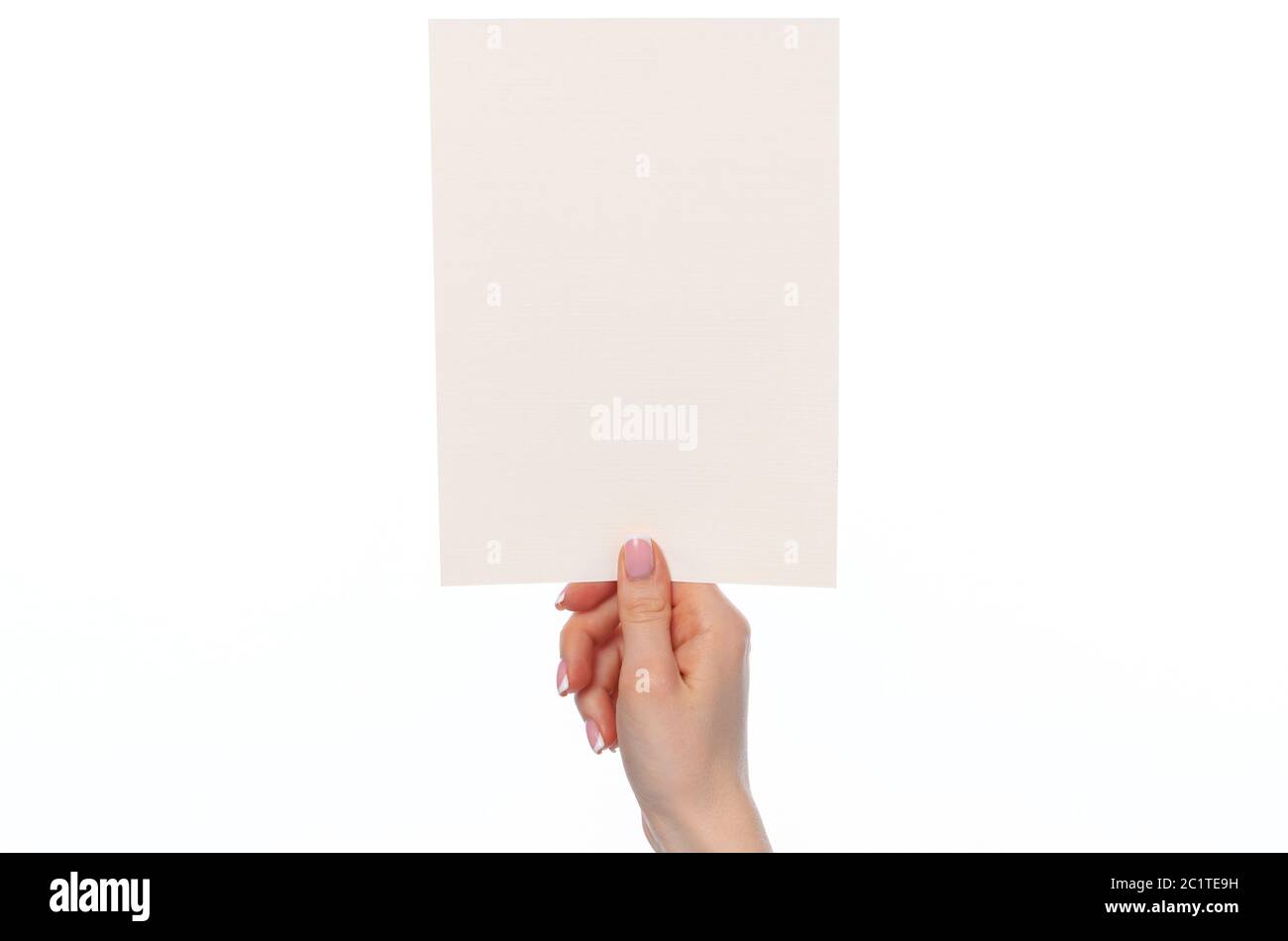 Female hand holding blank white sheet of paper isolated on white Stock ...