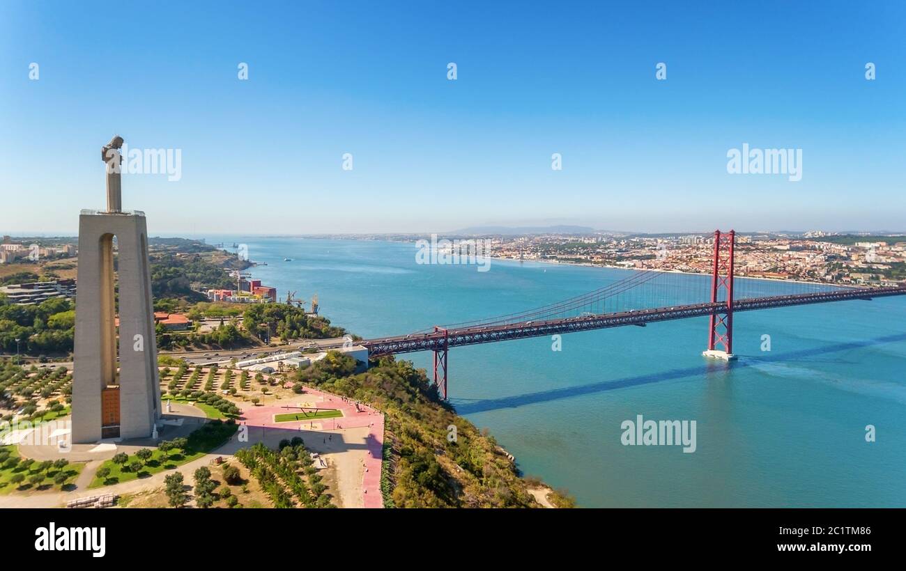 Aerial bridge on April 25th, Lisbon, Portugal. Statue of jesus christ lisbon. Close-up. Stock Photo