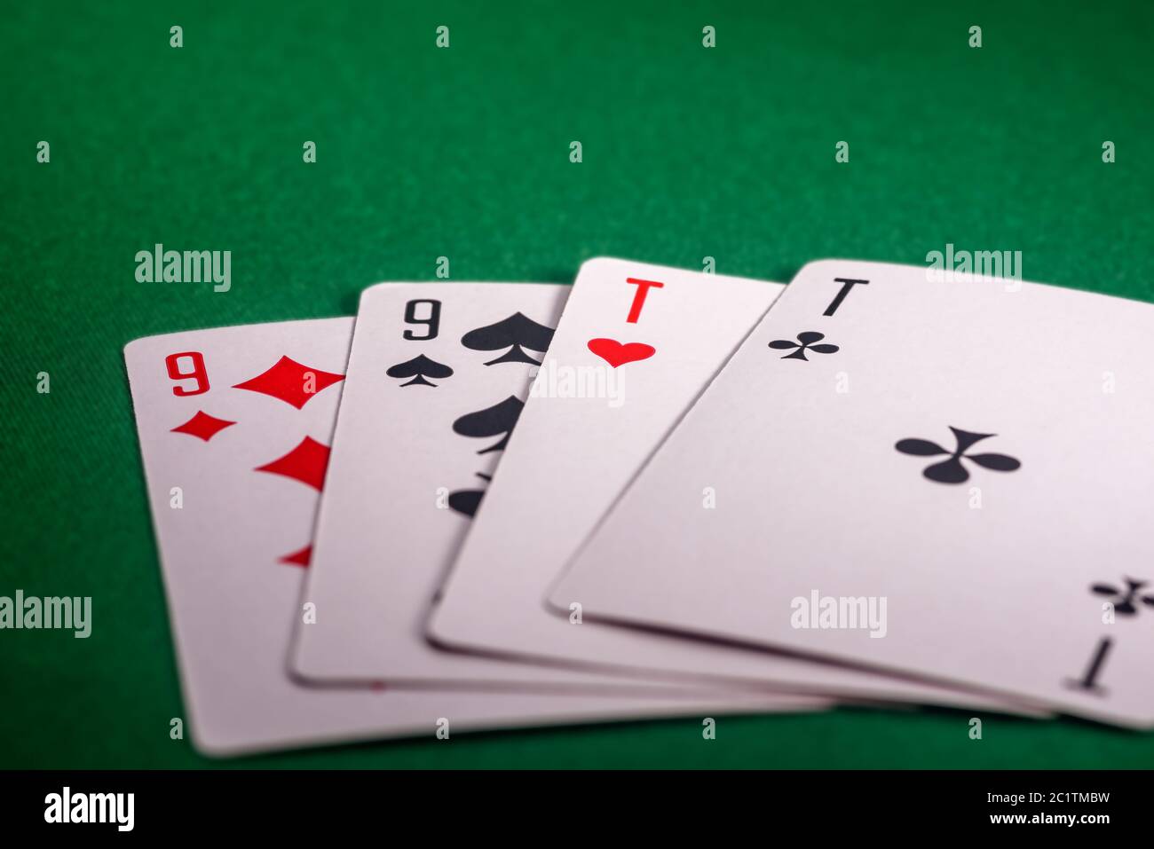 playing cards on the green table. Combination 'Two pair' in poker Stock Photo