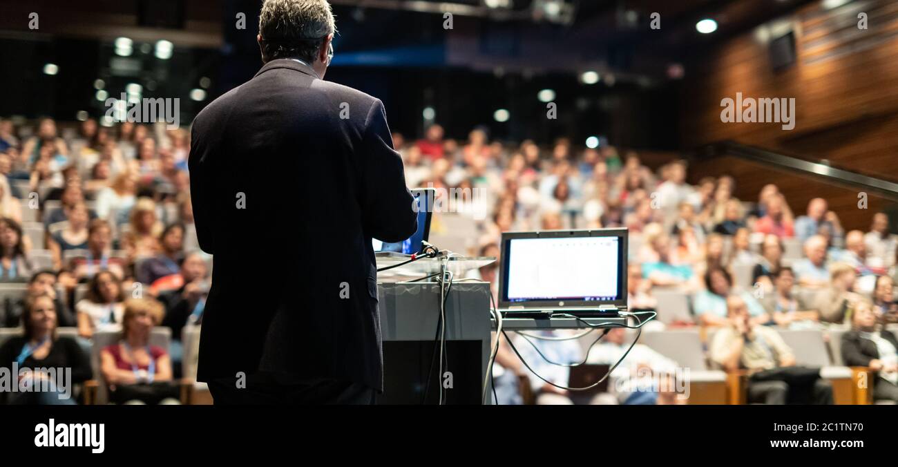 Public speaker giving talk at Business Event. Stock Photo