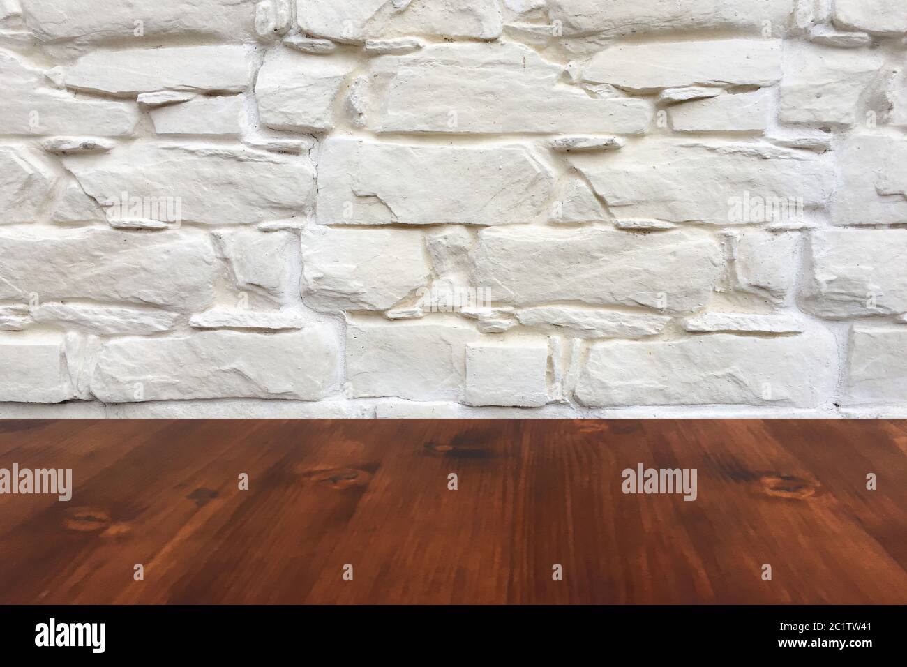old brown oak wooden table on the blurry white wash wall background, wood table. Stock Photo