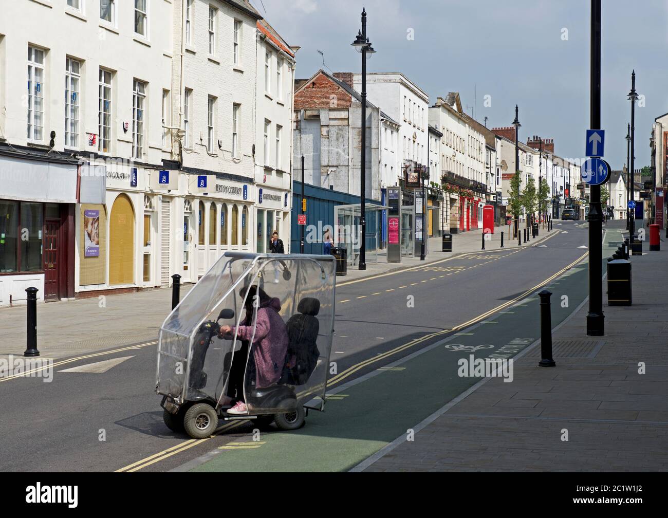Senior woman on mobility scooter, Hall Gate, Doncaster, South Yorkshire