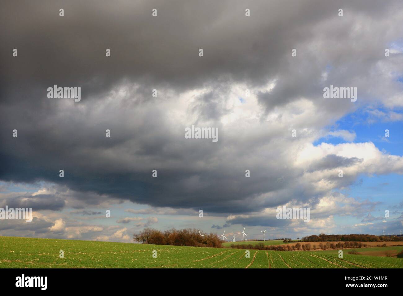 Big dark clouds over the land and the fields, weather in late winter in the Soester BÃ¶rde, North Rhine-Westphalia, Germany Stock Photo