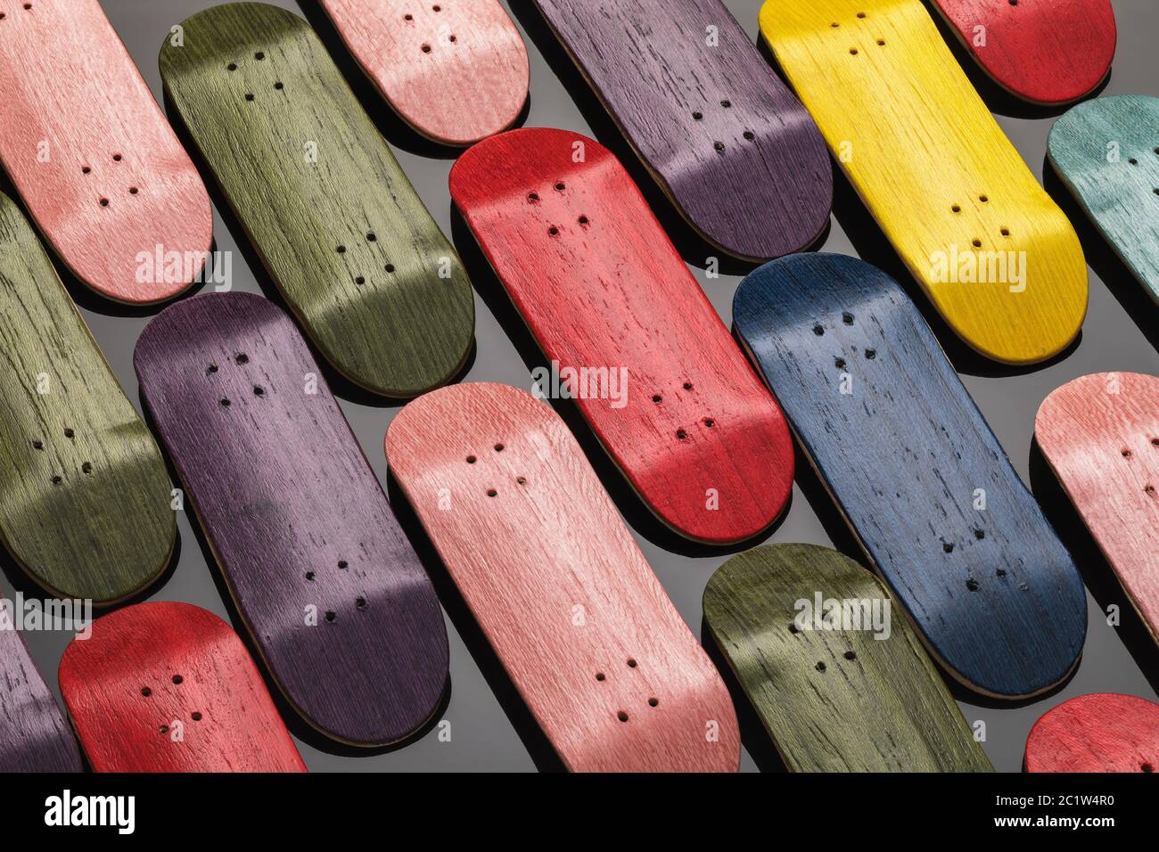 Background of multi-colored wooden boards for fingerboards Stock Photo