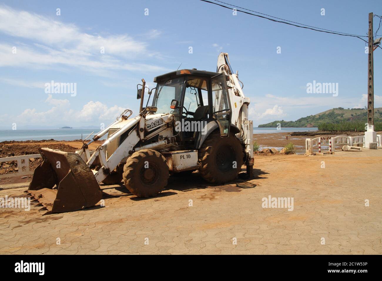 Bulldozer near Andoany or Hell-Ville harbour, Nosy Be, Madagascar. Stock Photo
