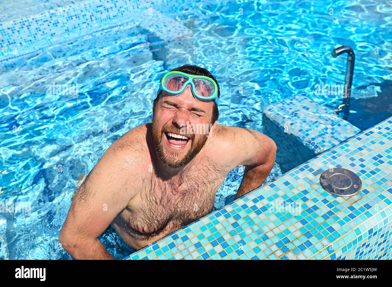 Funny man jumping in pool Stock Photo Alamy