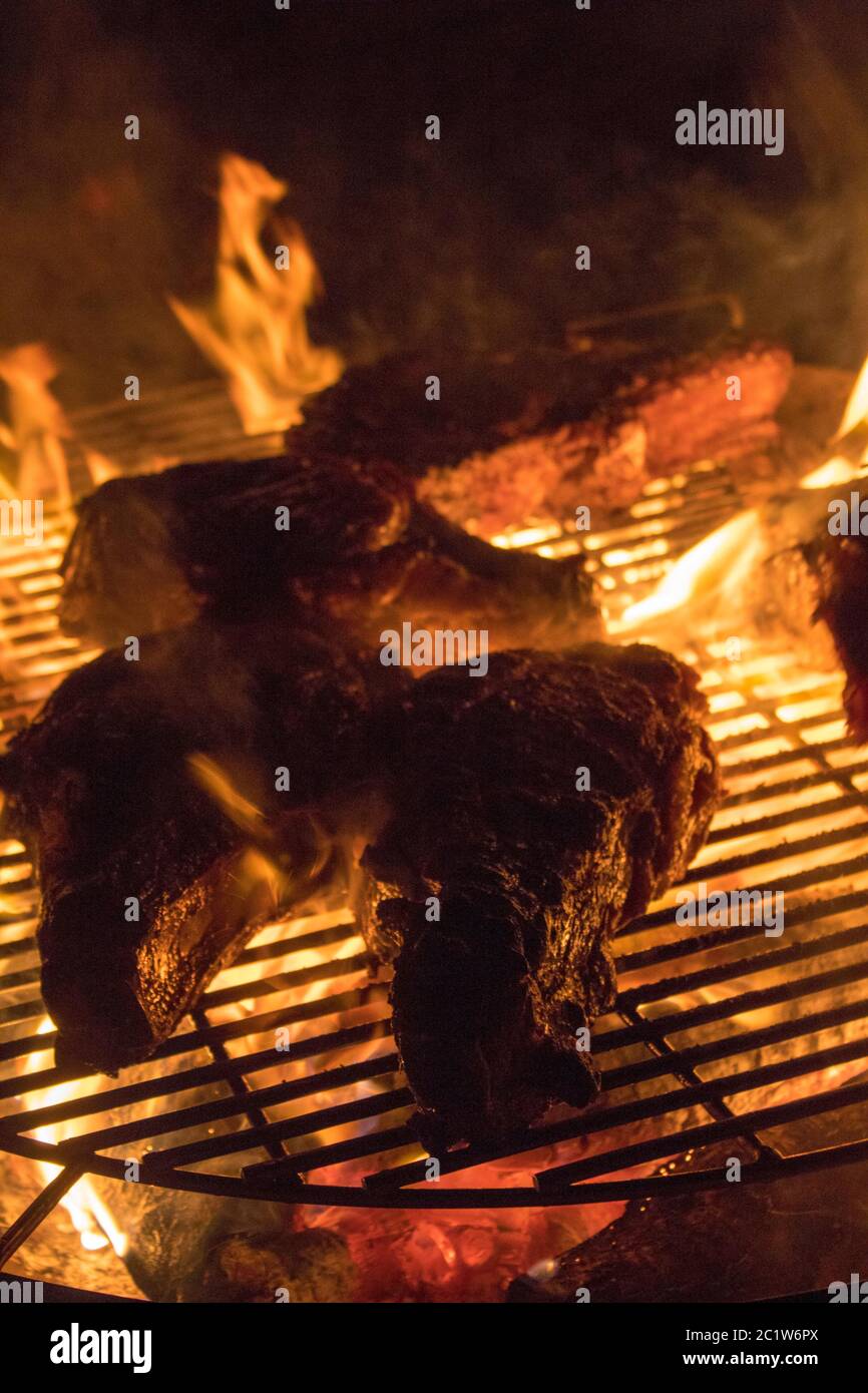 Grilling steak on open flames Stock Photo Alamy