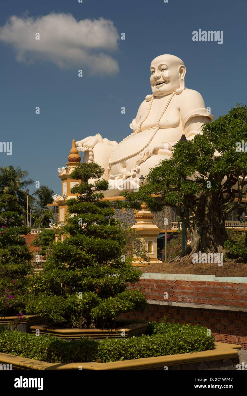 Big laughing sitting outdoor Buddha in Vinh Trang Pagoda in South Vietnam Stock Photo