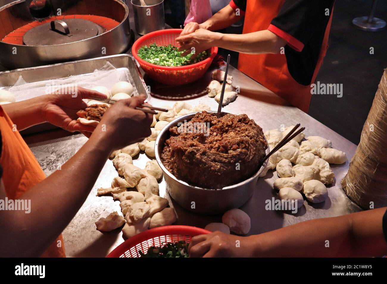 Taiwan night food market Raohe Night Market in Taipei. Street food preparation making black