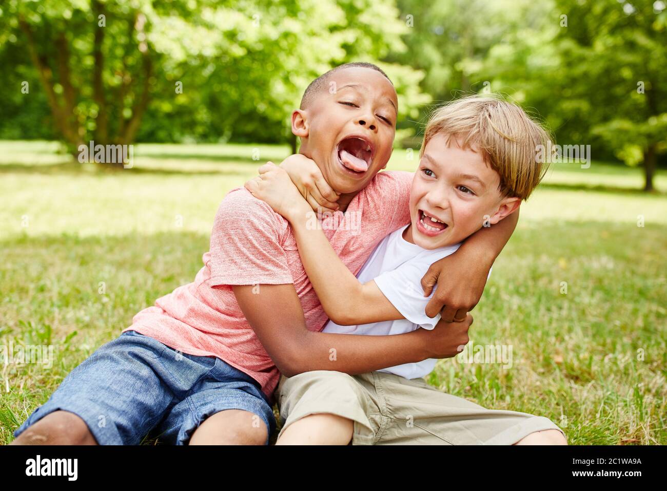 Two children fight and fight together in kindergarten Stock Photo