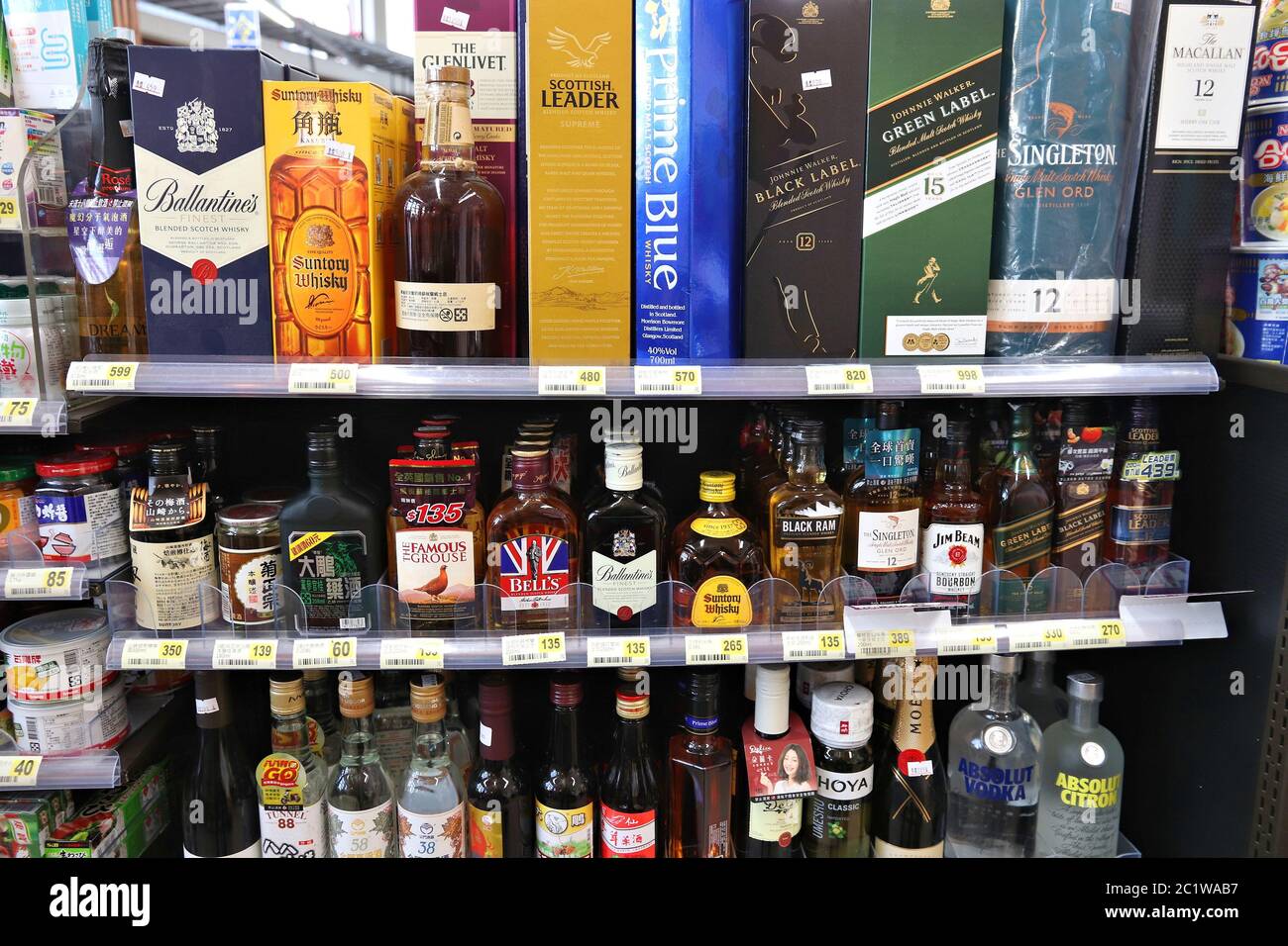 ALISHAN, TAIWAN - DECEMBER 1, 2018: Alcoholic beverage selection at a convenience store in Alishan, Taiwan. Multiple brands of whisky, bourbon and vod Stock Photo