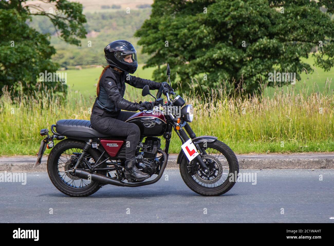 MH02OHO Woman riding 2019 Hanway RAW 125 E4 Cafe Racer; Motorbike rider;  two wheeled transport, motorcycles, vehicle, roads, motorbikes, bike riders  motoring in Chorley, UK Stock Photo - Alamy