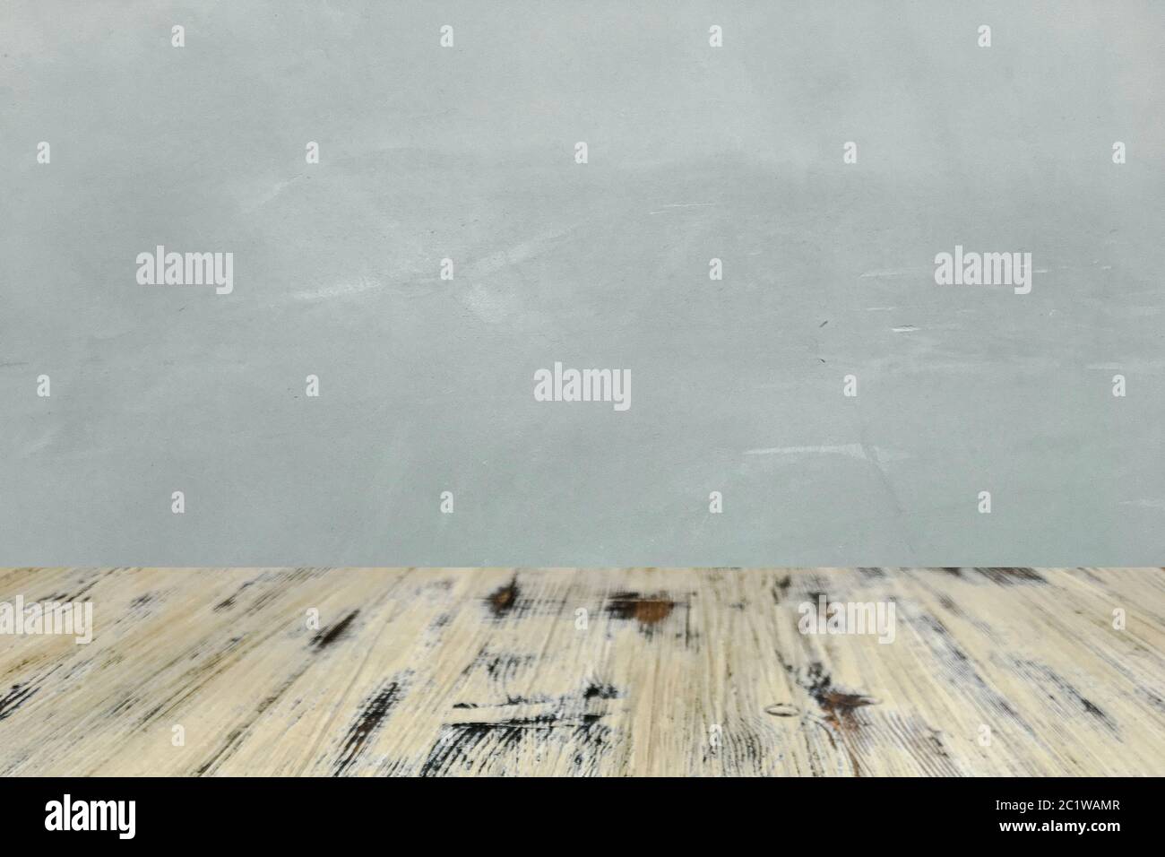 washed wood table with concrete texture background. Stock Photo