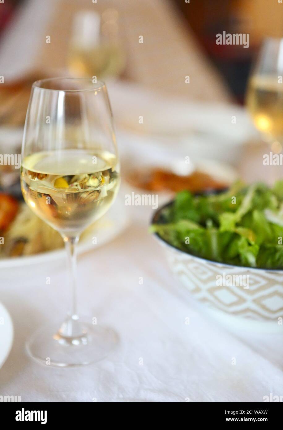 People fine dining seafood and white wine Stock Photo