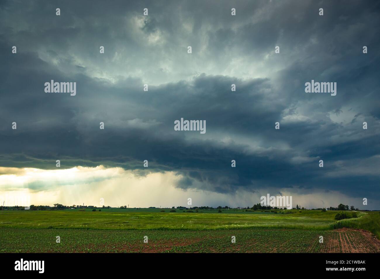 Supercell storm clouds with wall cloud and intense rain Stock Photo Alamy