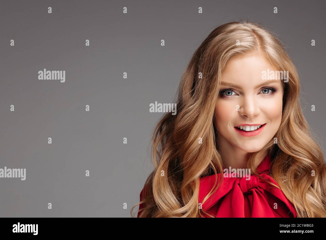 Portrait of beautiful young girl in red blouse with big bow Stock Photo Alamy