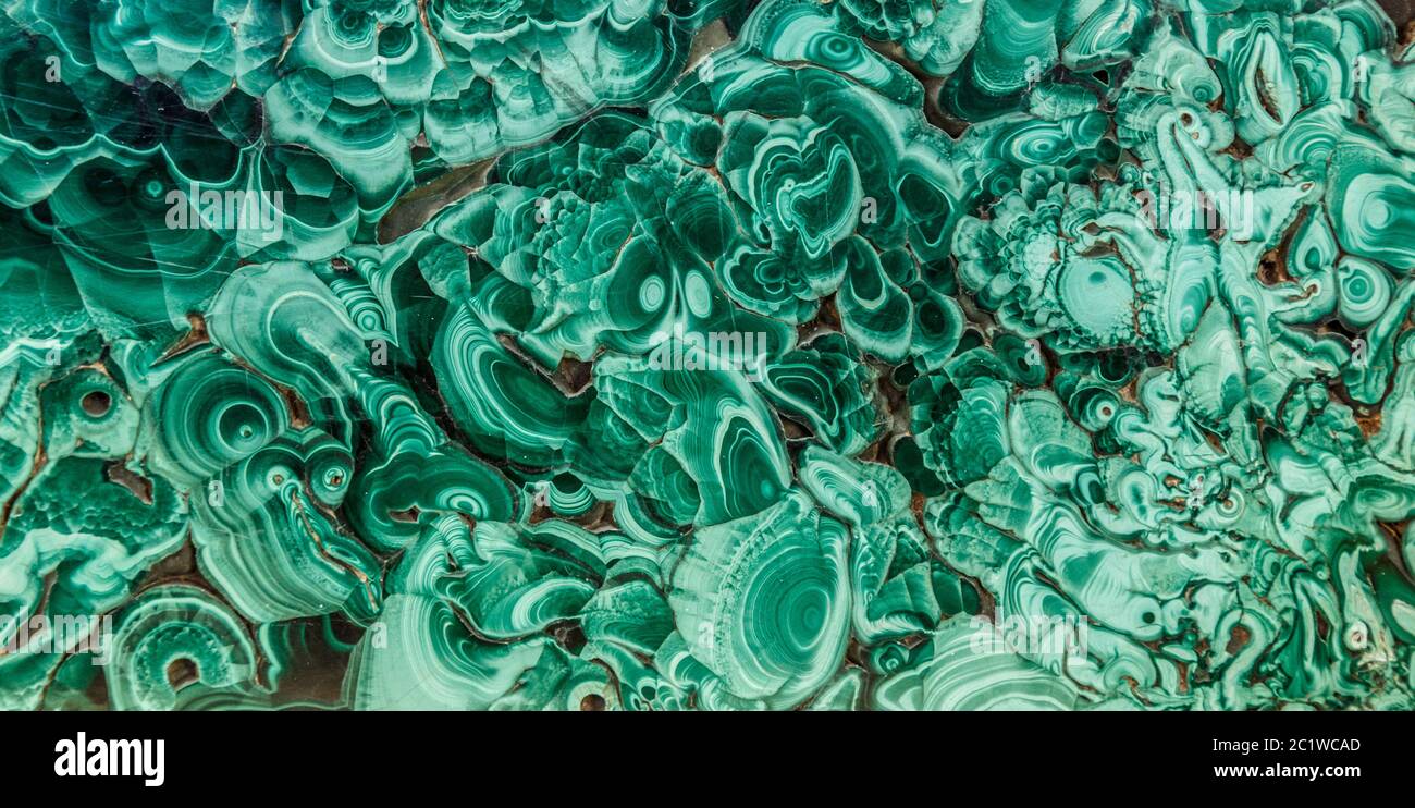 Malachite green mineral gemstone texture,malachite background, green background. Amazing polished natural slab of green malachit Stock Photo