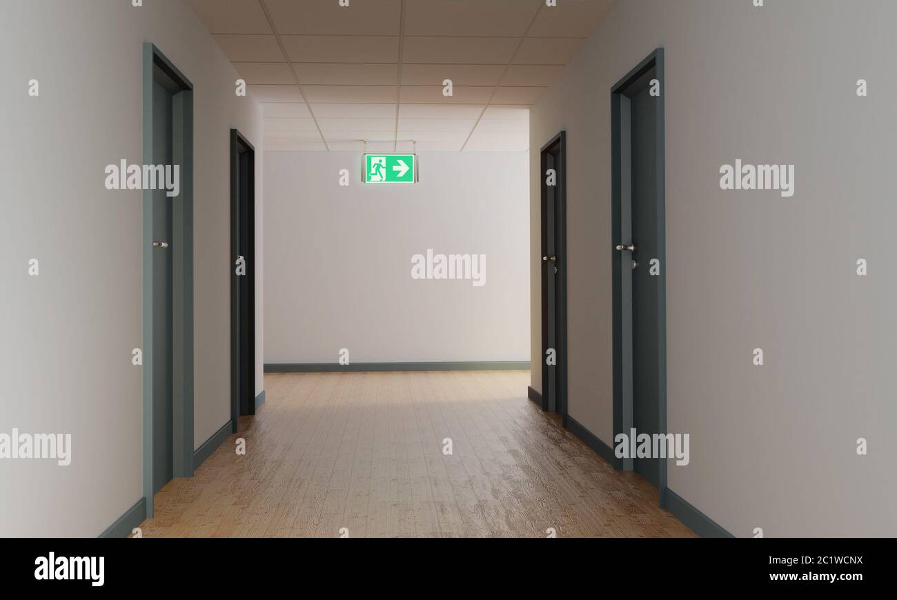 Corridor with an escape route and shield for the emergency exit to the right Stock Photo