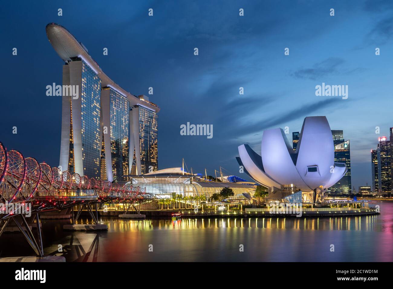 sunsent and night shots of the Marina Bay in Singapore Stock Photo
