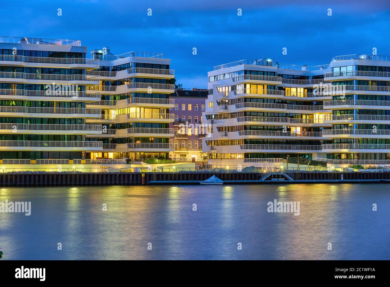 Modern apartment buildings at the river Spree in Berlin at night Stock Photo