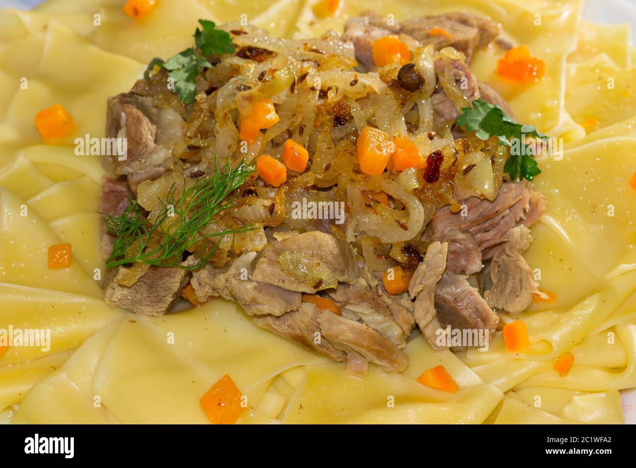 Beshbarmak - a traditional dish in Central Asia Stock Photo