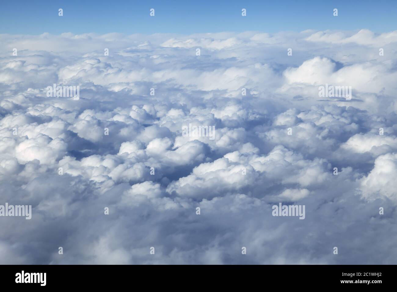 Clouds land below from airplane hi-res stock photography and images - Alamy