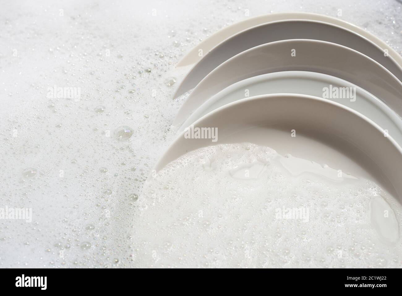 Dish washing, Dirty dishes soaking in kitchen sink Stock Photo Alamy