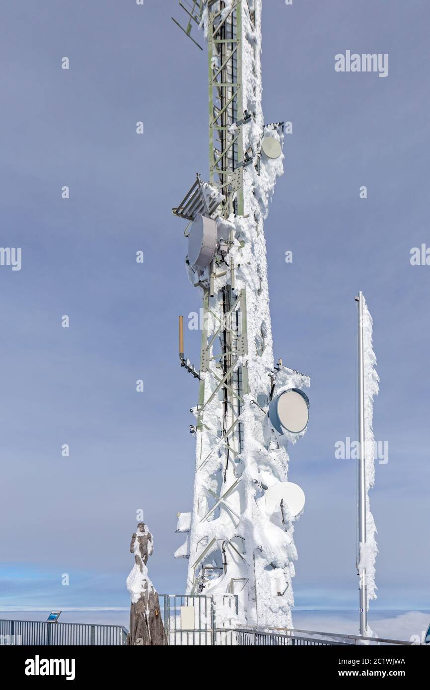 Radio mast on Zugspitze mountain summit in winter Stock Photo