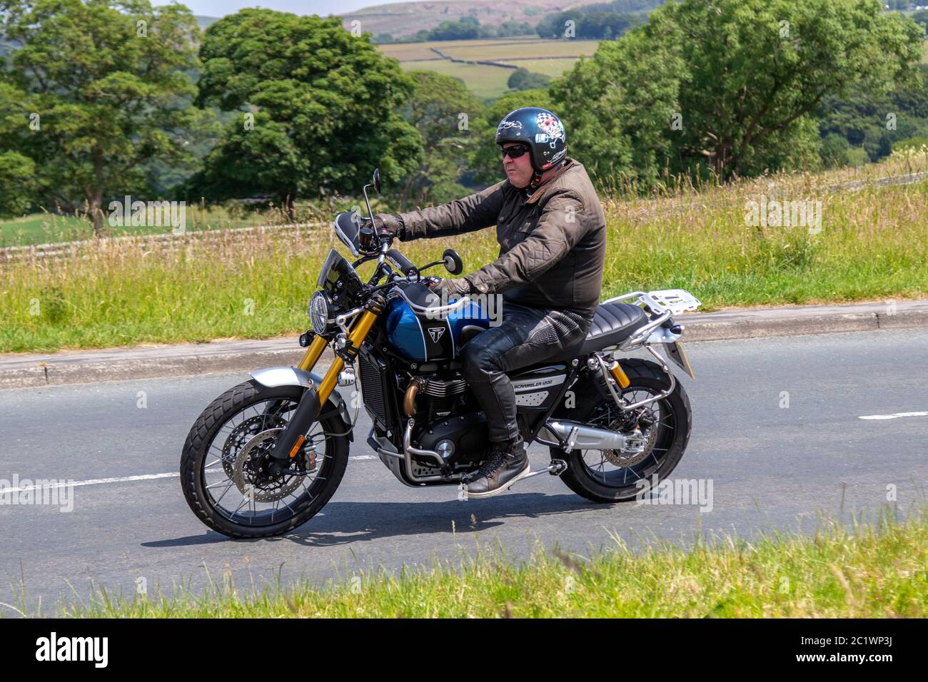 PE69 UTO 2019 Triumph Scrambler 1200 XE; Motorbike rider; two wheeled transport, motorcycles, vehicle, roads, motorbikes, bike riders motoring in Chorley, UK Stock Photo