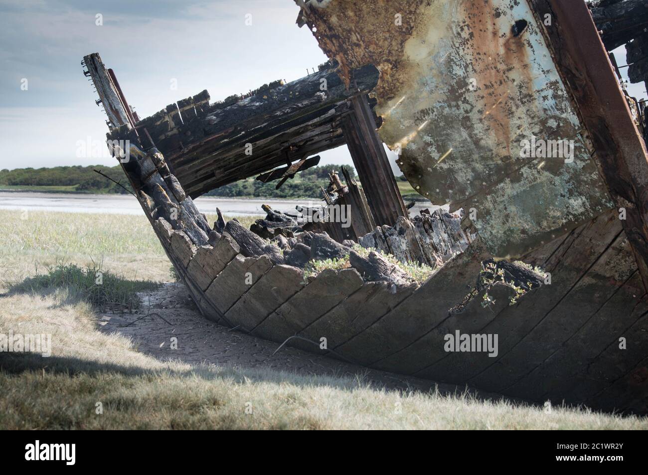 Old wooden shipwreck with hole Stock Photo