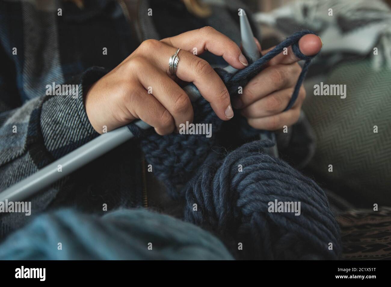 Girl knitting with yarn Stock Photo