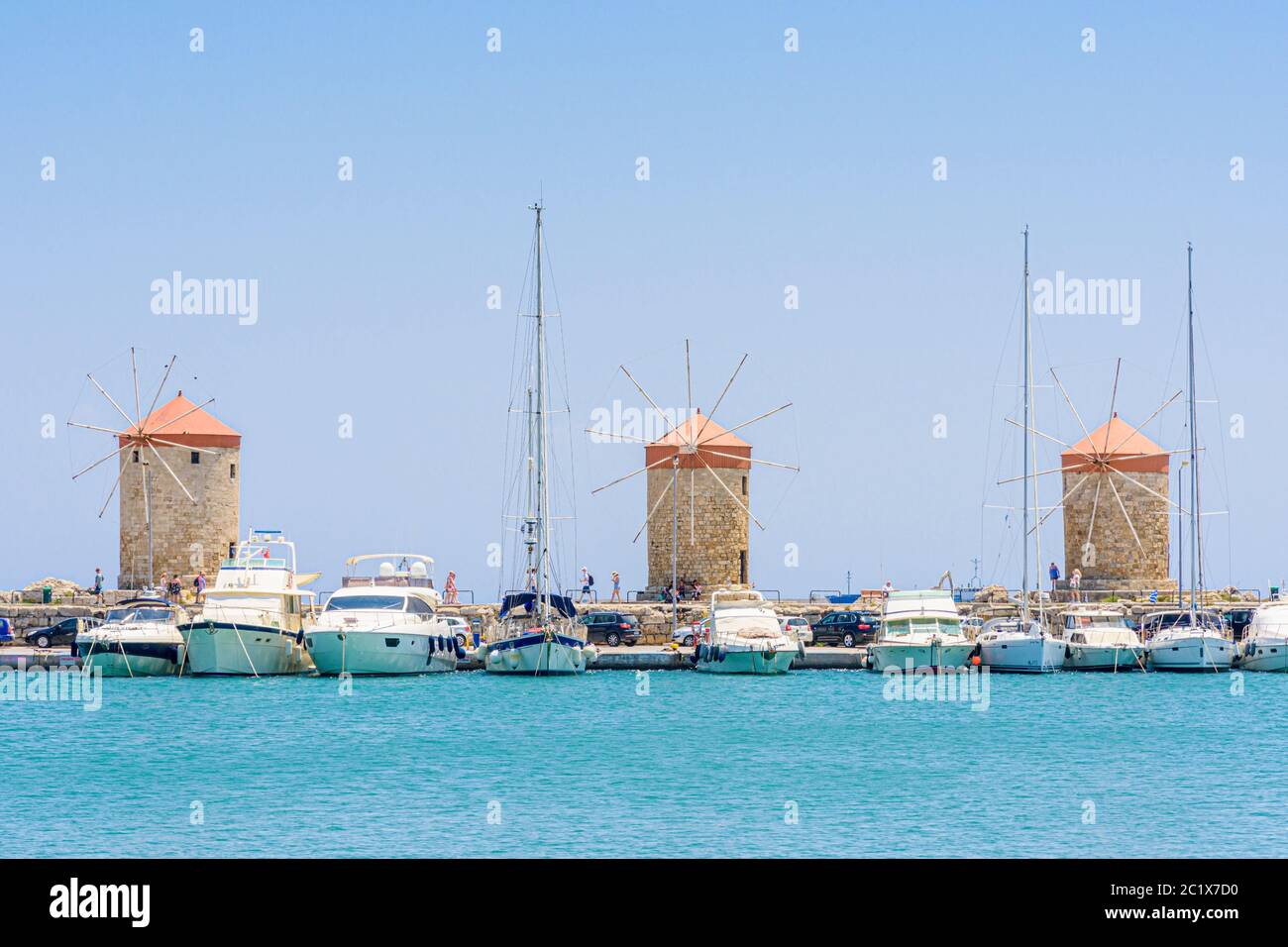 Rhodes Town windmills lining Mandraki harbor on the island of Rhodes, Dodecanese, Greece Stock Photo