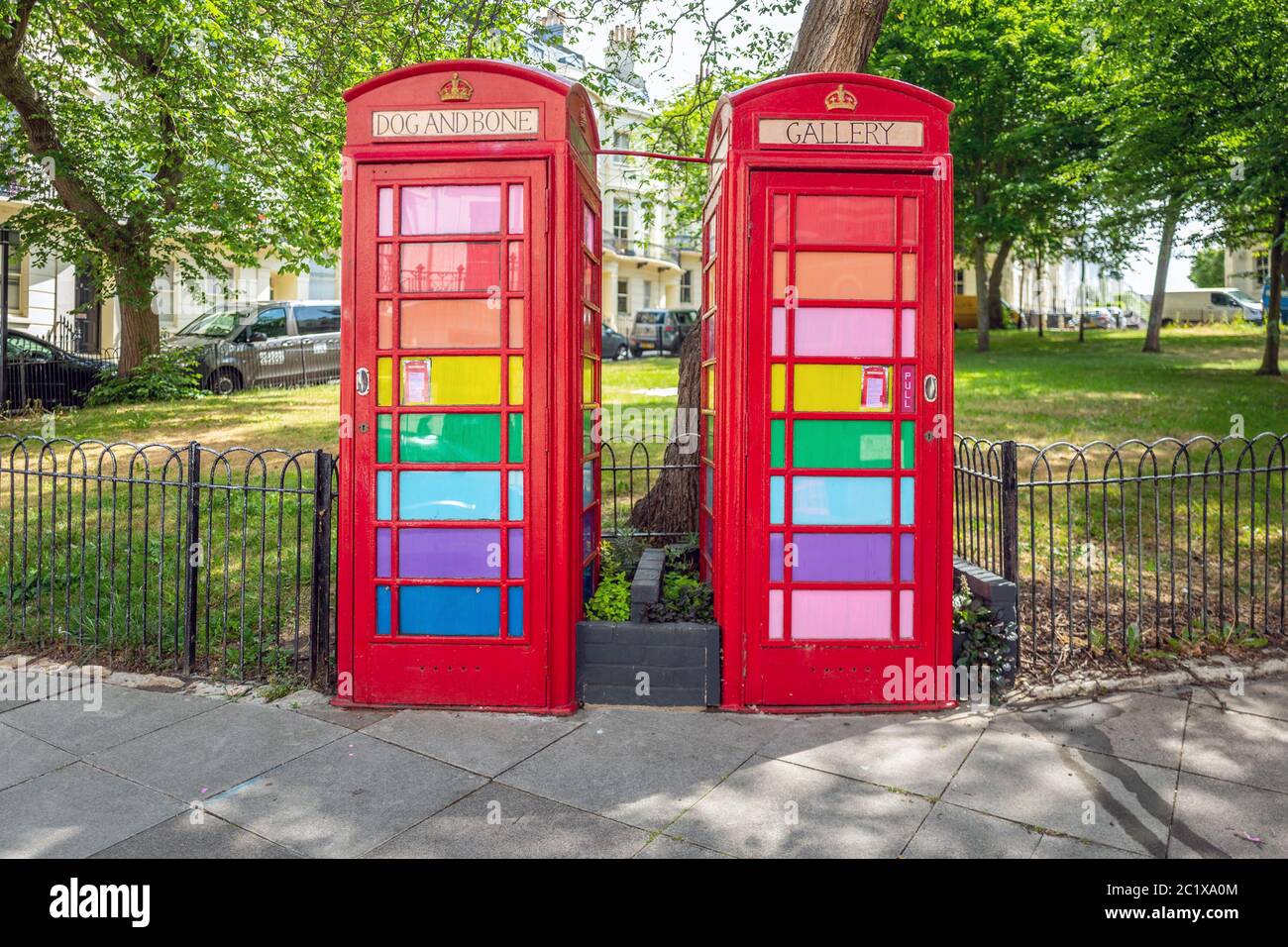 Brighton UK, 15th June 2020: View of Brighton with rainbow-themed former telephone boxes, now re-purposed as tiny art gallery Stock Photo