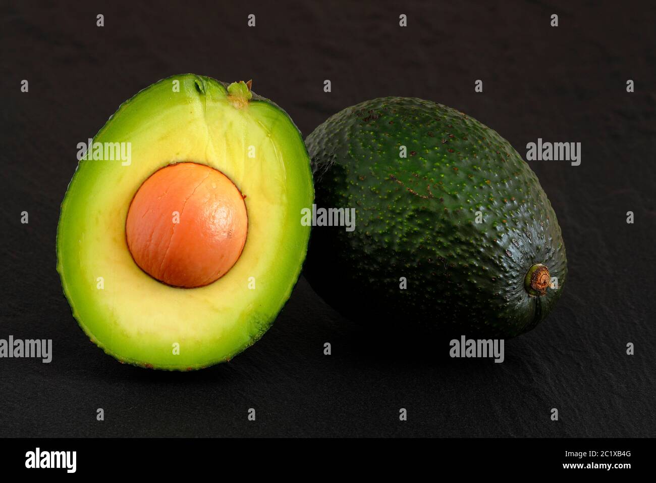 Fresh avocado fruit and vitamins Stock Photo Alamy